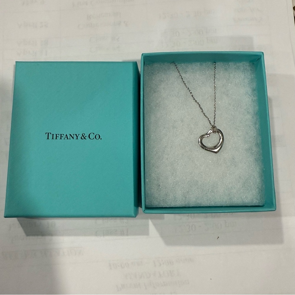 Tiffany & Co., this Elsa Peretti Mini Open Heart Necklace
